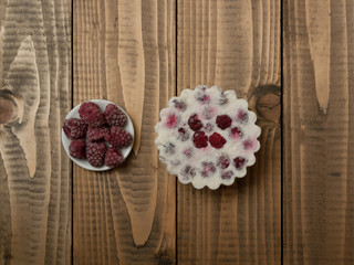 Tasty biscuit and fresh raspberry