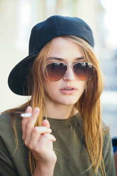 Pretty young girl smoking cigarette