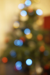 Blured christmas tree with colorful magic lights