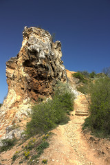 Fox montain rocks with blue sky, plants, stones and stairway