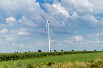 Windmill for electric power production in country side background, Poland