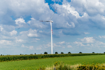 Windmill for electric power production in country side background, Poland