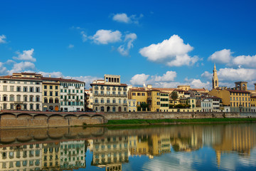Fototapeta na wymiar Embankment of the Arno River near Ponte Vecchio and Uffizi Gallery, Florence, Italy. Travel outdoor sightseeing background.