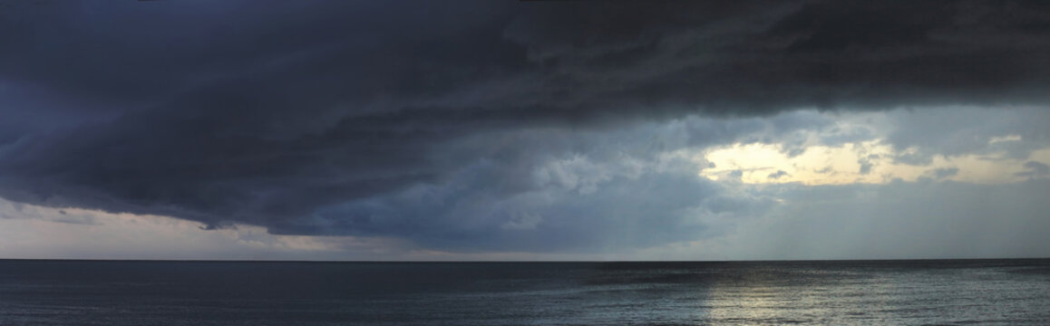 Heavy storm with dark clouds abow ocean