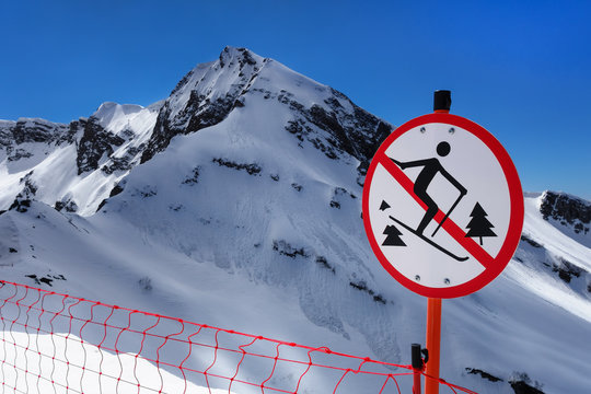 "No skiing outside ski trail" sign