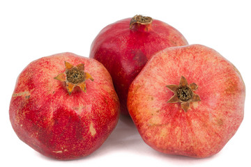Three ripe pomegranate, isolated on white background