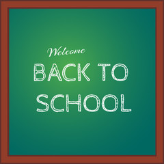 Back to school. Inscription on the green blackboard