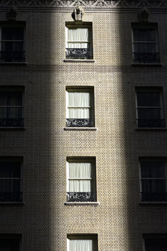  window in the shadow of a building in downtown San Francisco.