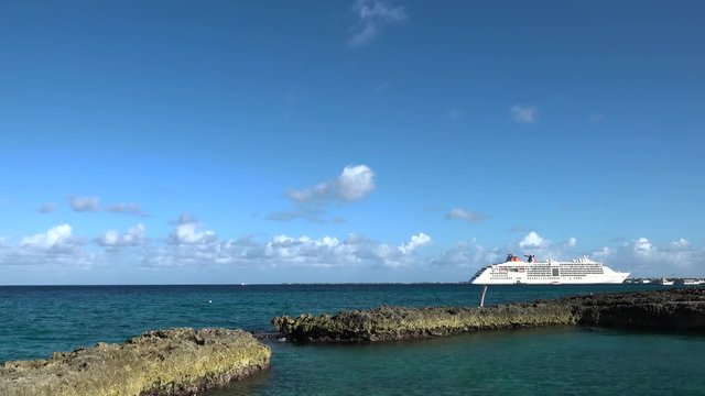 cruise ship moored in the caribbean on tropical seas timelapse