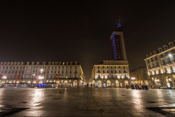 Fototapeta na wymiar night view of the illuminated piazza castello - castle square in the italian city torino.