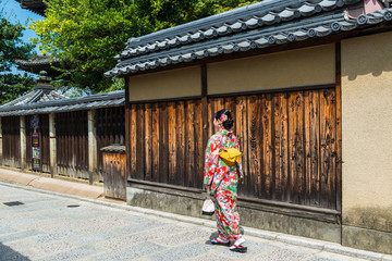 asian woman wearing kimono walking on the old street, Kyoto Japan