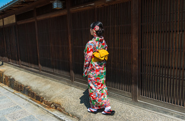 asian woman wearing kimono walking on the old street, Kyoto Japan
