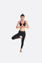 Young woman in yoga pose.