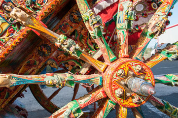 Fototapeta premium Close-up view of a colorful wheel of a typical sicilian cart during a folkloristic show