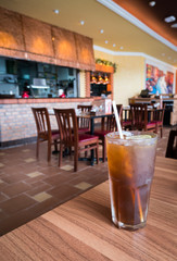 Glass of ice lemon tea in luxury restaurant