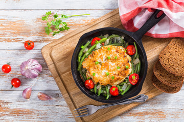 Chicken onion Fritters with stewed green beans in frying pan