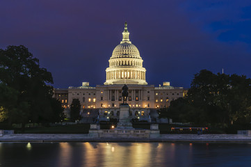 United States Capitol Building and Capitol Reflecting Pool at evening after sunset, Washington...