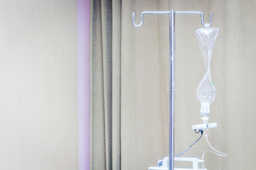 Fototapeta na wymiar Infusion bottle with IV solution in hospital
