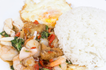 Rice topped with stir-fried combination of pork,squid, shrimp, b