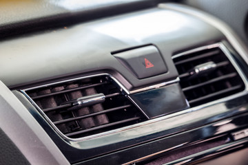 Fototapeta na wymiar Air conditioner in modern car interior detail