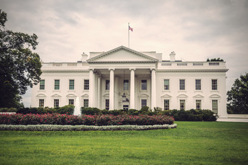 Obraz premium The White House in Washington D.C. at a cloudy day, Executive Office of the President of the United States, Vintage filtered style