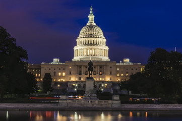 United States Capitol Building and Capitol Reflecting Pool at evening after sunset, Washington...