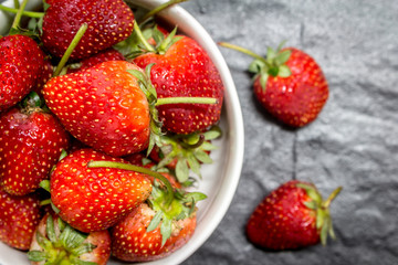 Fresh strawberries on black background