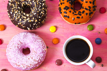 cup of coffee with donuts and smarties