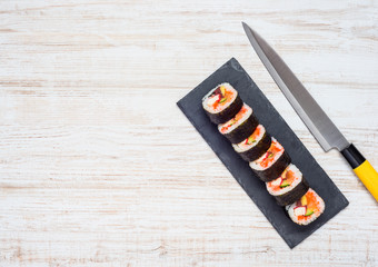 Sliced Sushi and Knife With Copy Space