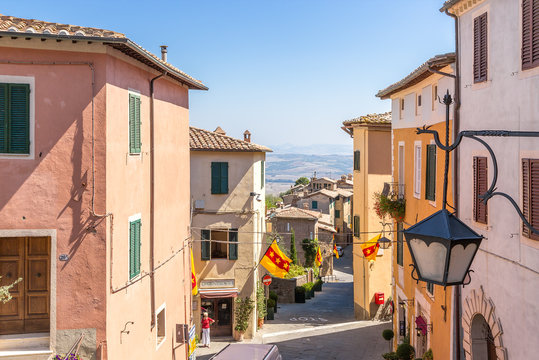 Fototapeta Montalcino, Italy. Street decorated with flags