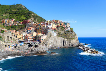 Fototapeta na wymiar Cinque Terre village Manarola with colorful houses and Mediterranean Sea, Italy