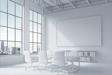 Close up of poster and conference room table and city view