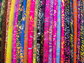 Colorful sarongs on sale in the market at Ubud in Bali, Indonesia.