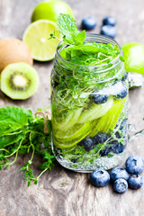 Detox  water. Homemade summer fruit drink with lime and kiwi and