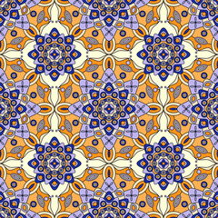 Seamless ethnic geometric pattern in shades of blue, yellow & orange. 