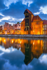 Naklejka premium Old town of Gdansk with ancient crane at dusk, Poland