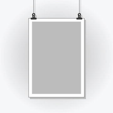 Template Poster. Blank paper in a light frame hanging with clips