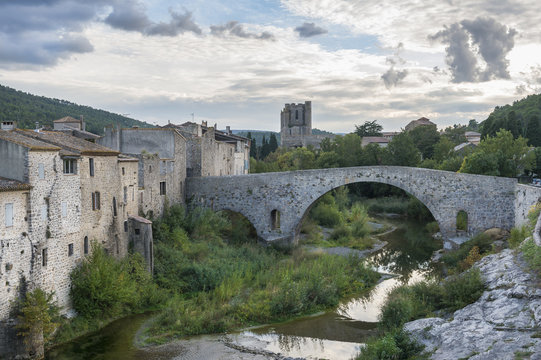 View of the medieval bridge and city of Lagrasse, France