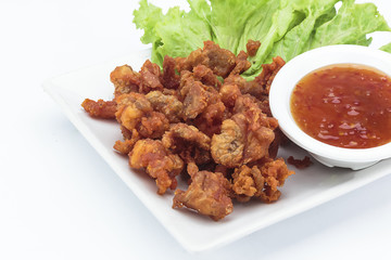 Fried chicken skin on white background