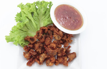 Fried chicken skin on white background
