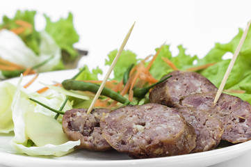 Sour pork and vegetable snacks in Thailand on white background