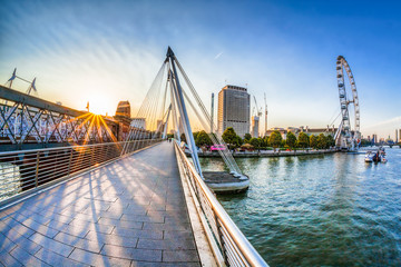 Golden Jubilee Bridge against sunrise in London, England, UK