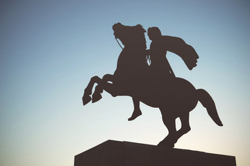 Silhouette of Alexander the Great Statue at sunset. Thessaloniki,shooting as blur