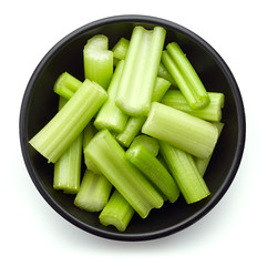 Bowl of celery isolated on white, from above