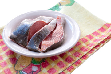 Sliced red raw fish lying on a plate  