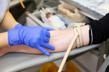 Blood sampling from a hand of the person. Donorship. Blood trans