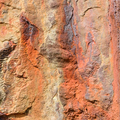 Rusty eroded metal sea defences on coast