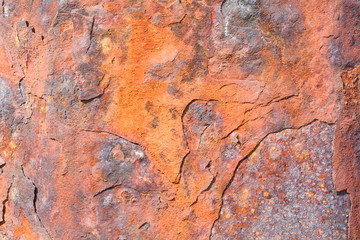 Rusty eroded metal sea defences on coast
