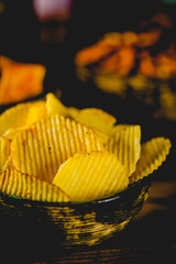 Chips on wooden table, party concept
