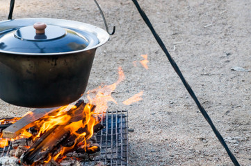 Fire burning under the cauldron